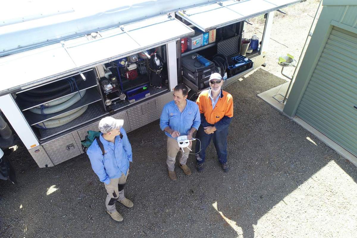 Crew gathered at the open side of the purpose-built dive truck