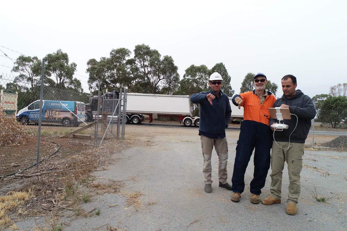 Crew beside the dive truck on site at a reservoir