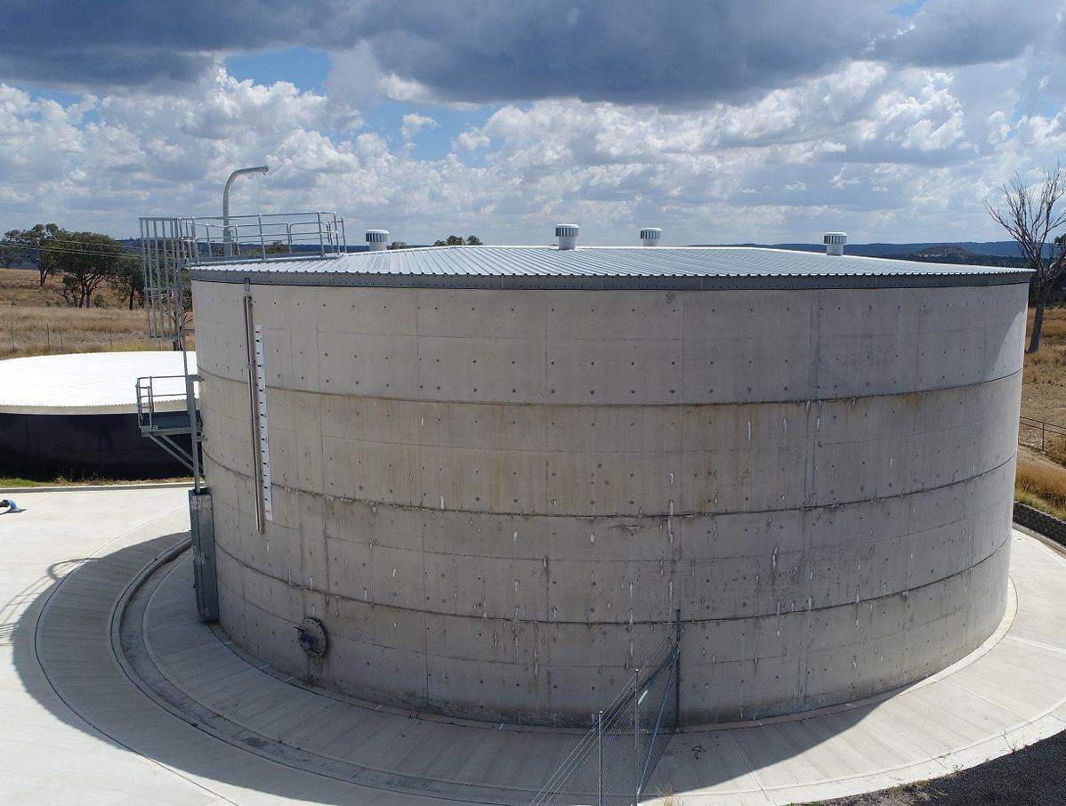 Exterior of a large circular concrete water reservoir