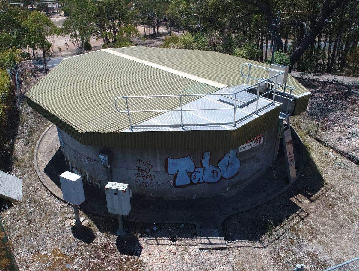 Aerial view of an elevated tank roof and access platform