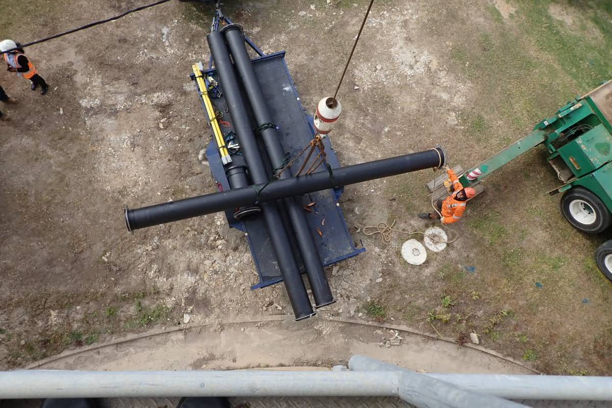 Sections of large-diameter HDPE pipework being assembled on site