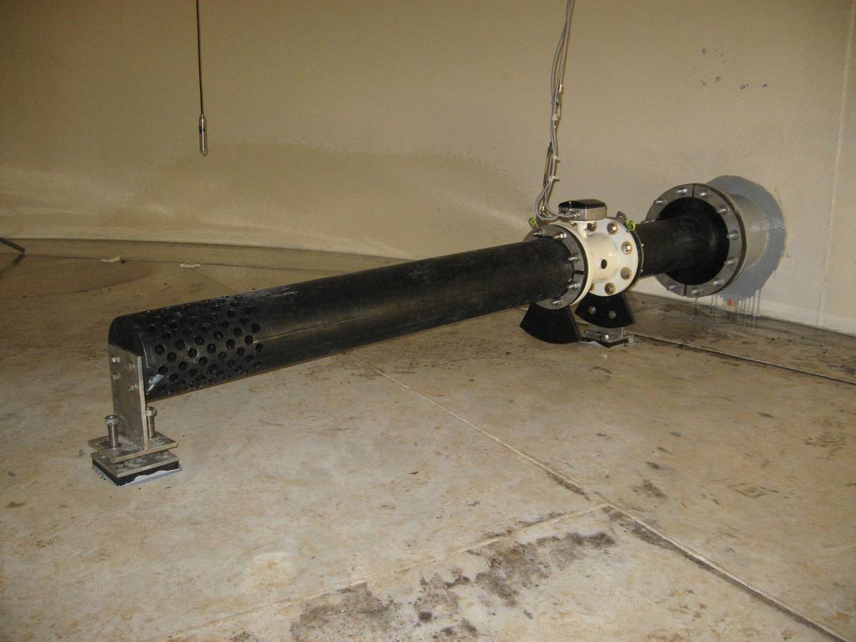 HDPE pipework spool installed on stainless steel supports inside a reservoir