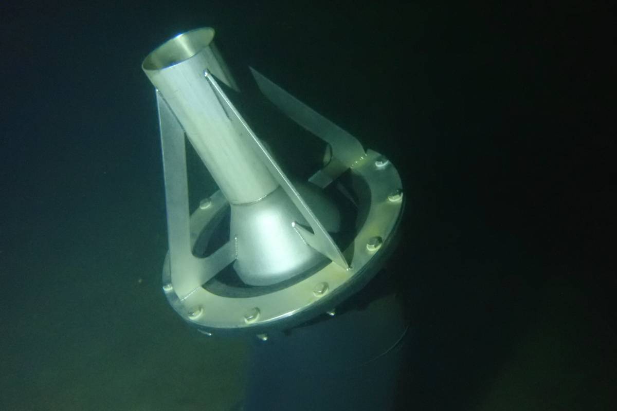 Stainless steel Ram Tube mounted on its bracket inside a reservoir