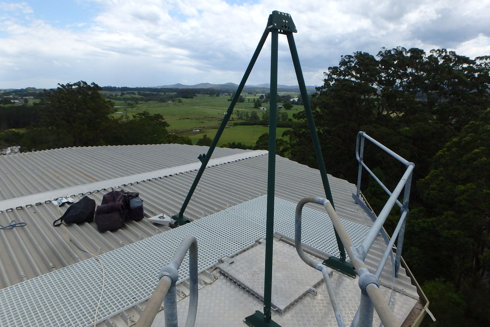 Titan Arm anchor frame fitted to a tank roof platform beside the access handrails